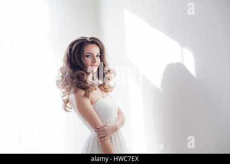 girl model posing in a white room Stock Photo