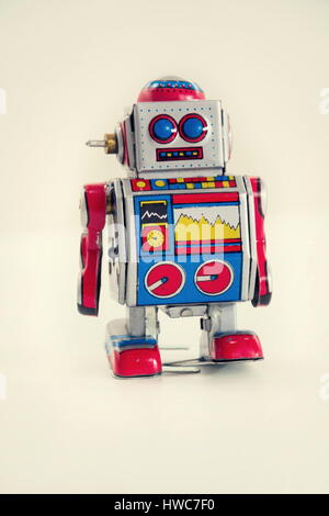 Filtered vintage tin toy robot isolated on white background Stock Photo