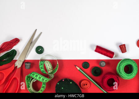 Sewing accessories in red and green colors. Stock Photo
