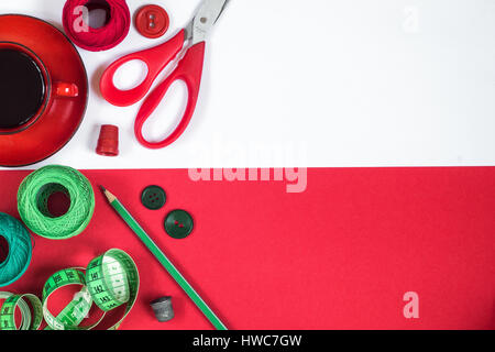 Sewing accessories in red and green colors. Stock Photo