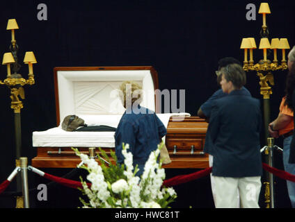 Mourners view the casket of singer Ray Charles at the Los Angeles ...