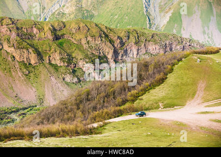SUV Car On Off Road In Summer Mountains Landscape. Active Lifestyle, Drive And Travel Concept. Stock Photo