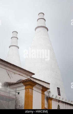 Sintra, Portugal: The landmark conical chimneys rise from the kitchen of Sintra National Palace Historic House Museum. Also called Town Palace, the me Stock Photo