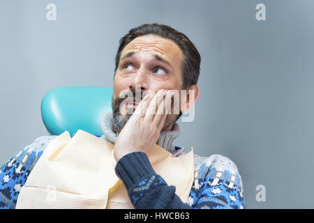 Adult man having toothache. Stock Photo