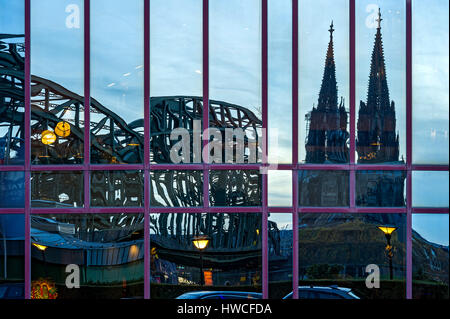 Reflection in glass facade of the Hyatt Regency Hotel, Hohenzollern Bridge, Cologne Cathedral, Cologne, North Rhine-Westphalia Stock Photo
