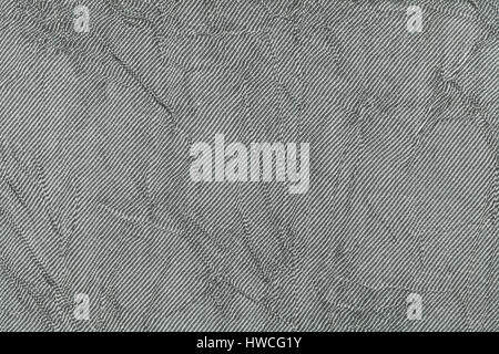 Light gray wavy background from a textile material. Fabric with natural texture closeup. Upholstery fabric pleated. Stock Photo