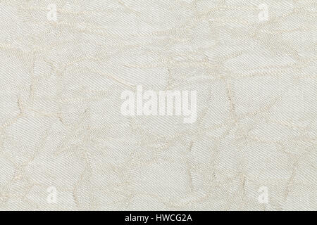 White cream wavy background from a textile material. Fabric with natural texture clousup. Upholstery fabric pleated. Stock Photo