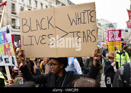 Protesters holding a sign march through the streets of downtown Los ...