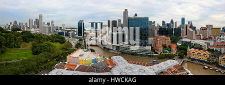 Horizontal panoramic (2 picture stitch) cityscape of Singapore with Clarke Quay in the foreground and Stock Photo