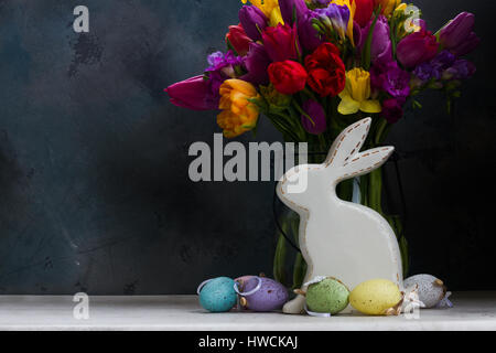 Spring flowers with easter rabbit and eggs Stock Photo