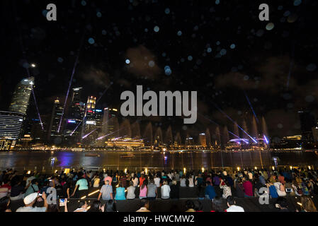 Horizontal view of the audience watching the Wonder Full light and sound show at night in Singapore. Stock Photo