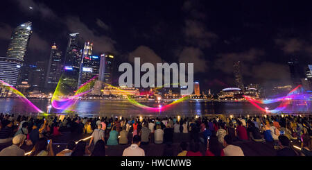 Horizontal view of the laser displays at the Wonder Full light and sound show at night in Singapore. Stock Photo