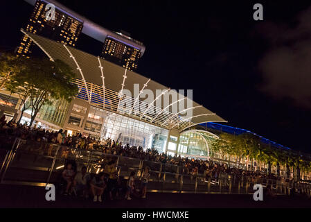 Horizontal view of crowds gathering on the promenade for the light and sound show infront of the Shopp Stock Photo