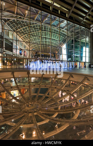 Vertical view of the Rain Oculus at the Shoppes at Marina Bay Sands at night in Singapore. Stock Photo