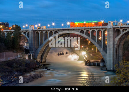 The Monroe Street Bridge is a deck arch bridge that spans the Spokane River in Spokane, Washington. It was built in 1911. Stock Photo