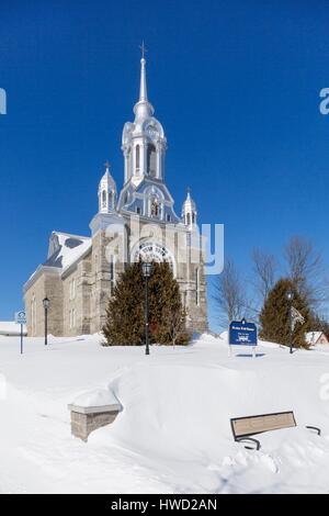 Canada, Quebec province, the Laurentians, Saint Sauveur, the village church with a and silver roof Stock Photo