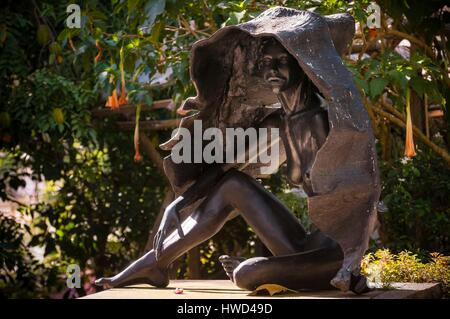 Seychelles, Mahe Island, Tom BOWERS carving a young Seychellois girl in ...