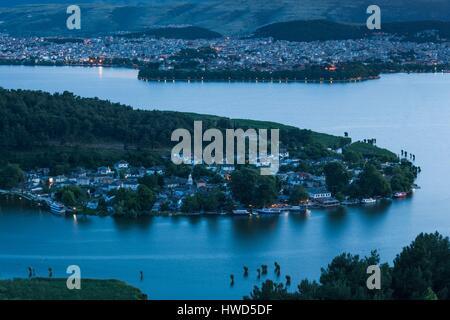 Greece, Epirus Region, Ioannina, elevated city view, Lake Pamvotis and Nisi Island, dusk Stock Photo