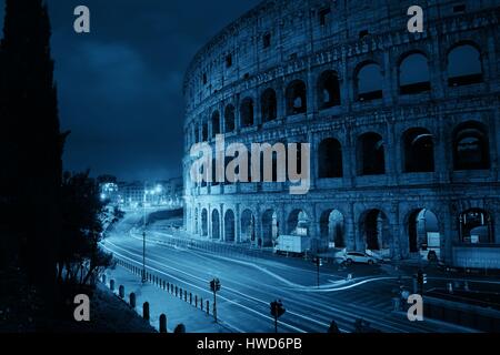 Colosseum at night with light trail in Rome, Italy. Stock Photo