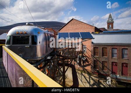 United States, Massachusetts, North Adams, Mass MOCA, Massachusetts Museum of Contemporary Art, Flying Airstream, The Shining, from the work, All Utopias Fell by artist Michael Oatman, exterior Stock Photo