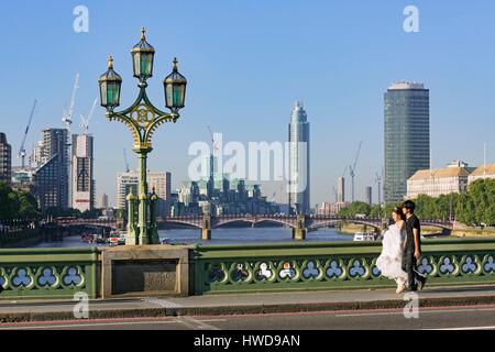 United Kingdom, London, Westminster district, Westminster Bridge, towers and buildings under construction, and newlywed couple Stock Photo