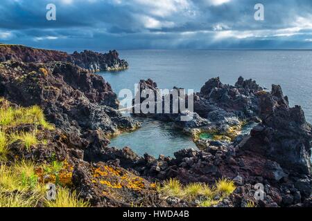 Portugal, Azores archipelago, Pico island, Ponta da Ilha, coastal hiking path through lava flows Stock Photo