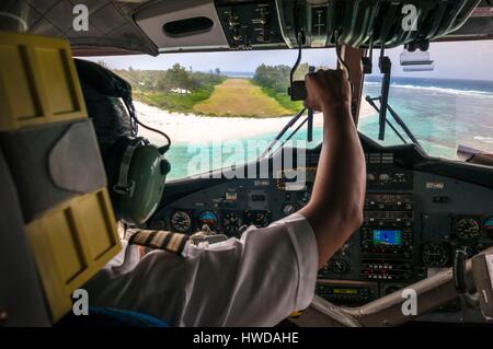 Seychelles, Bird Island, above the lagoon, landing on the grass runway seen from the cockpit of a Twin Otter of Air Seychelles coming from Mahé Stock Photo
