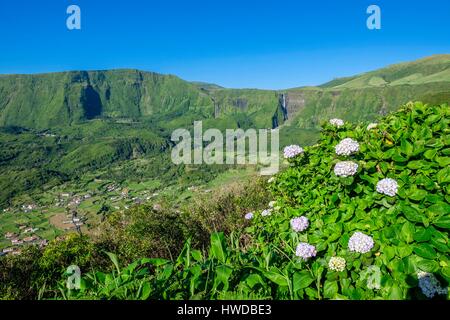 Portugal, Azores archipelago, Flores island, panorama from Miradouro do Portal, view over Fajazinha, Poço da Ribeira do Ferreiro waterfalls in the background Stock Photo