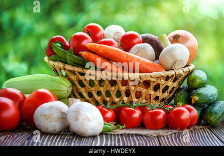 Fresh vegetables on a brown background  on an old wooden table Stock Photo