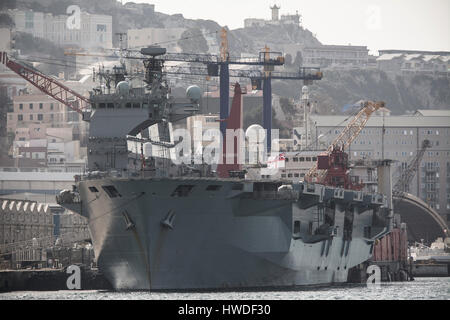 The British Royal Navy carrier HMS Ocean berthed at the British Naval Base in Gibraltar on the 18th March 2017 as it prepared to make its way to the U Stock Photo