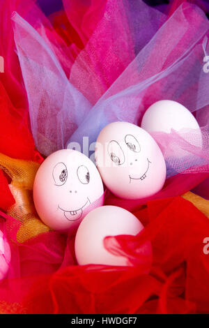 Easter eggs with funny faces on colorful and bright background. Emoji funny egg. Stock Photo