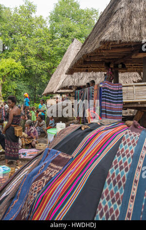 Selling Fabric in Abui Village, near Kalabahi, Pulau Alor, Indonesia Stock Photo