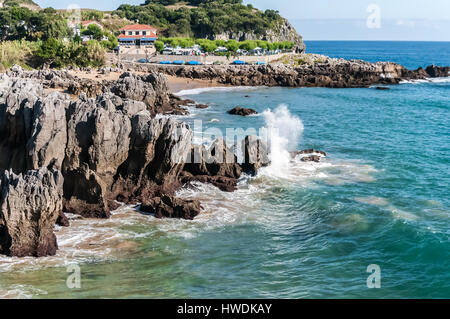 Waves Splashing Against Rocks Stock Photo