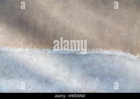 old plastered wall, half painted for backgrounds Stock Photo