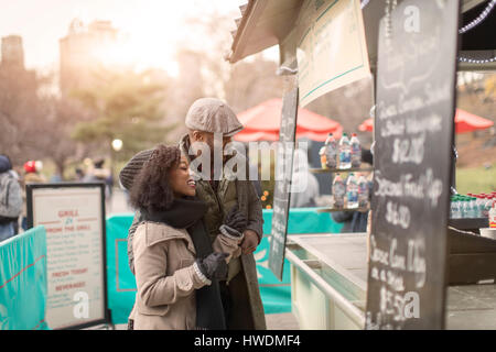 Couple choosing food at food stall, New York, USA Stock Photo