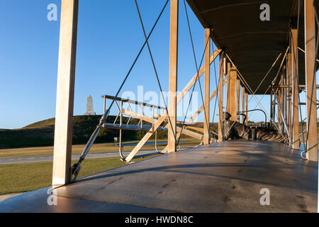 NC00666-00...NORTH CAROLINA - December 17, 1903 sculpture of the Wright Brothers histohic flight at Wright Brothers National Memorial in Kitty Hawk. Stock Photo