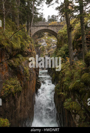 Water rushing beneath the Pont D'Espagne in the Pyrenees, France Stock Photo