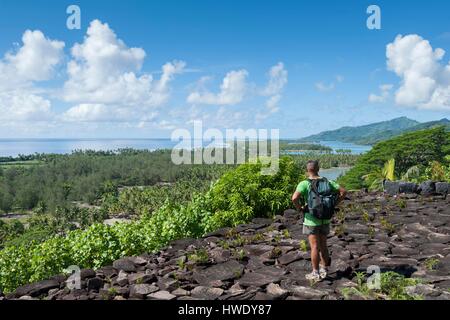 France, French Polynesia, Society Archipelago, Huahine island, hiker on a marae Stock Photo