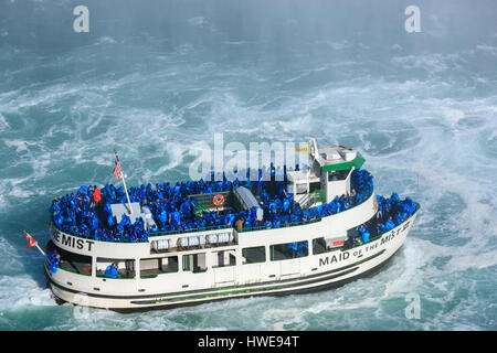 The Maid of the Mist loaded with tourists entering the Horseshoe Falls, part of the Niagara Falls, Ontario, Canada. Stock Photo