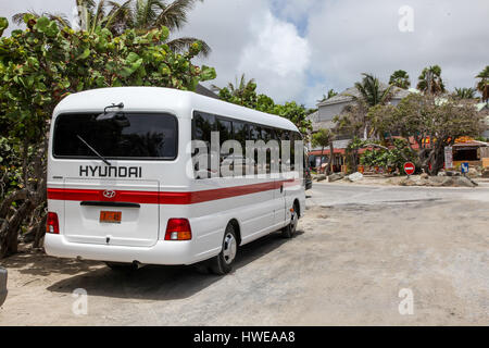 Sint Maarten, Sint Maarten. August 2, 2015.Hyundai bus standing near Bikini beach entrance on Orient Bay (Baie Orientale) area  in Sint Maarten. Stock Photo