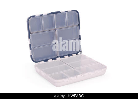 Opened white plastic box for fishing tackle on an isolated white background. Clipping path Stock Photo