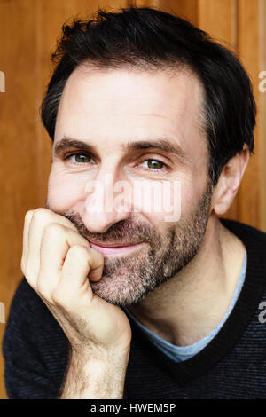 Head and shoulder portrait of smiling bearded mature man Stock Photo