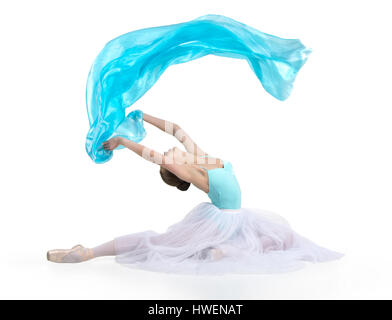 Young, smiling woman dancing the ballet. Studio shot of ballet on a white background. The isolated image.ing ballet. Stock Photo
