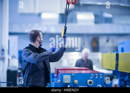 Engineer operating heavy machinery Stock Photo
