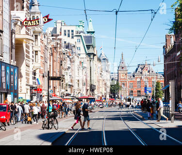 A view along Damrak, looking North towards Amsterdam Centraal Railway Station Stock Photo