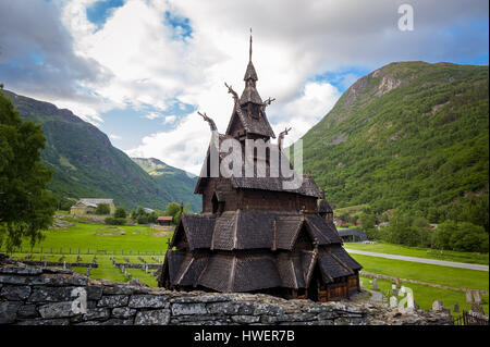 Borgund Stave Church and mountain background Stock Photo