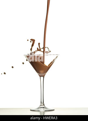 macro shoot with hot chocolate falling in glass on white in studio Stock Photo