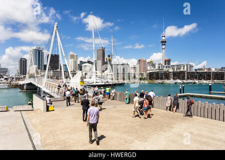 AUCKLAND, NEW ZEALAND - MARCH 1, 2017: People cross the bridge that links the Wynyard district to the Viaduct Marina in Auckland, New Zealand largest  Stock Photo