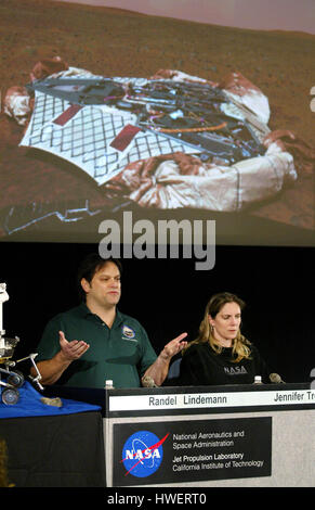 Randel Lindemann, (L) an engineer with the Jet Propulsion Laboratory, and Jennifer Trosper, mission manager for the Mars Rover Spirit, talk about the latest image transmitted from Mars during a press conference at the Jet Propulsion Laboratory in Pasadena, California on Wednesday, 21, January 2004. The image of the lander on the surface of Mars can be seen in the overhead projection. Photo by Francis Specker Stock Photo