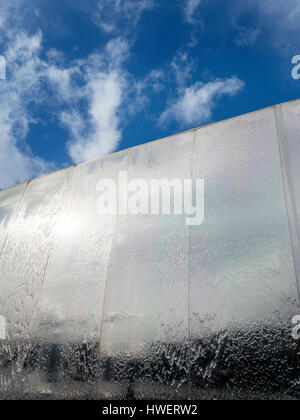 Water Cascading over the Cutting Edge Stainless Steel Sculpture in Sheaf Square Sheffield South Yorkshire England Stock Photo